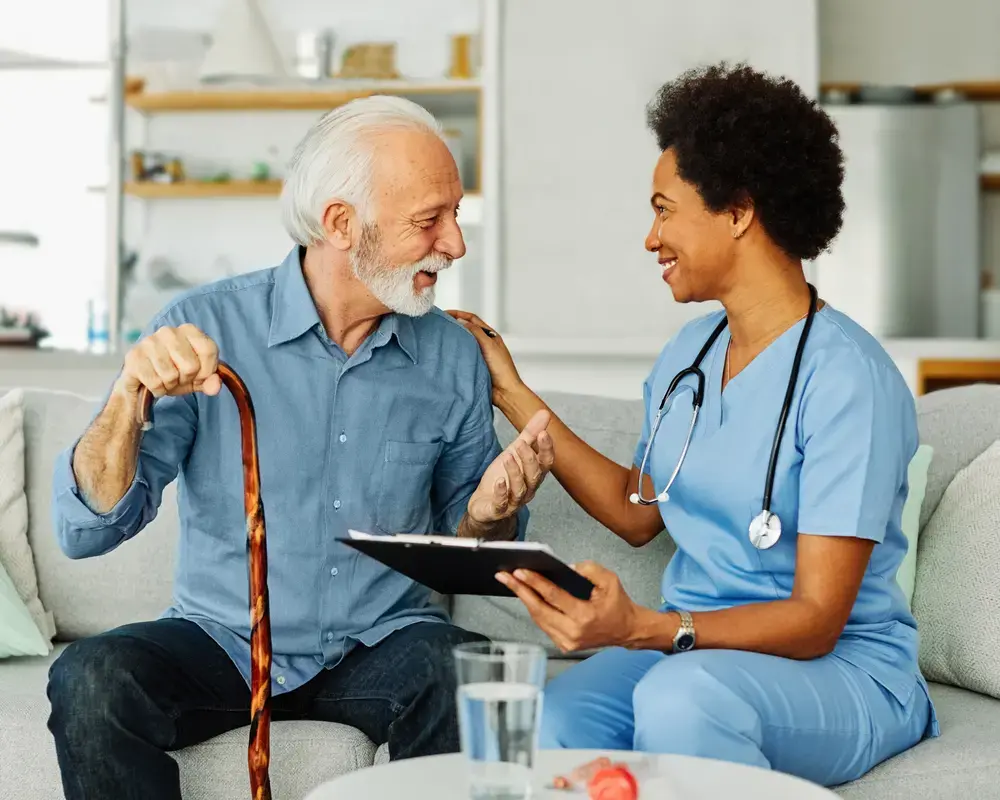 Senior patient chatting to doctor