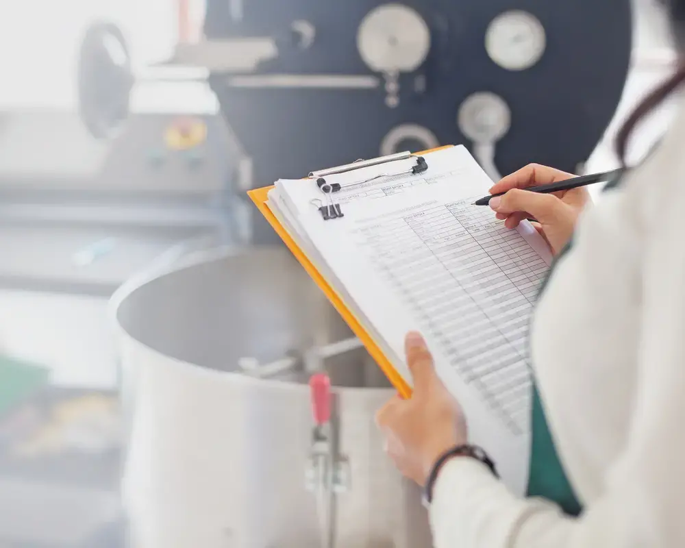 Clinician using clipboard to mark off drug information