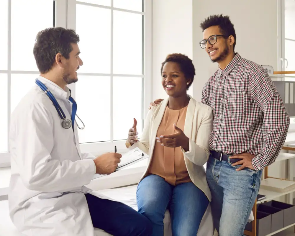 Doctor talking with couple patients