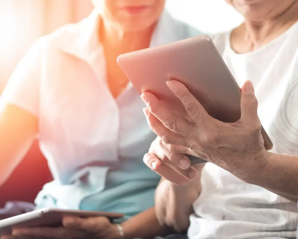 Patient holding a tablet with an electronic clinical outcome assessment