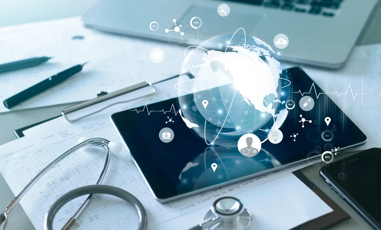 Globe on iPad with medical materials around it