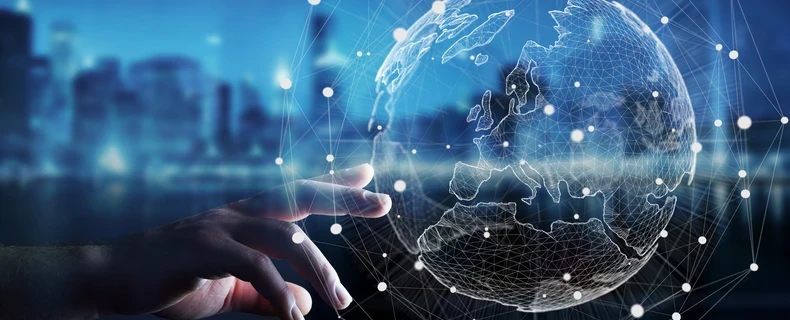 Hand reaching out towards global economy